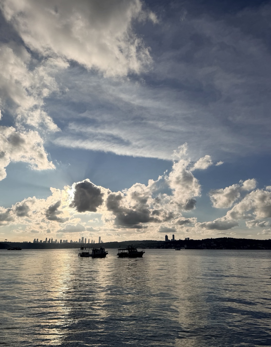 Cloud over the Bosphorus, two boats on the water
